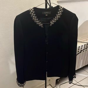 Gorgeous two piece black skirt suit.  Beading around the neckline and cuffs.